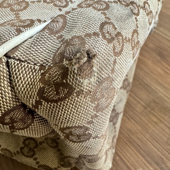 Gucci diaper bag with striped strap